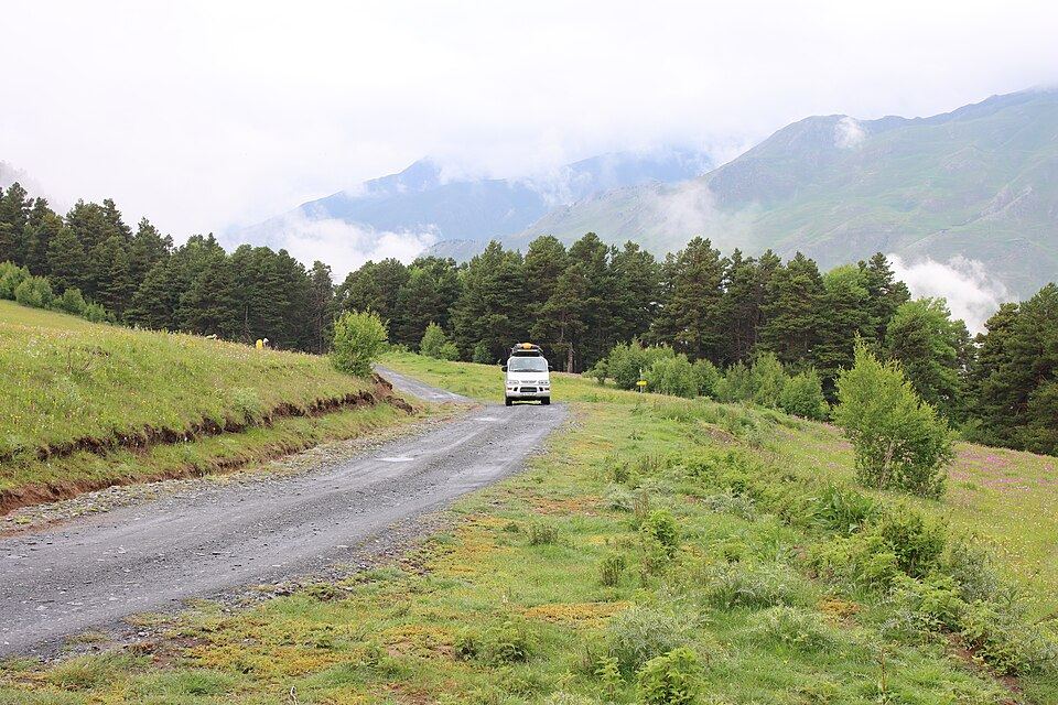 Car on a mountain road in Tusheti, Georgia